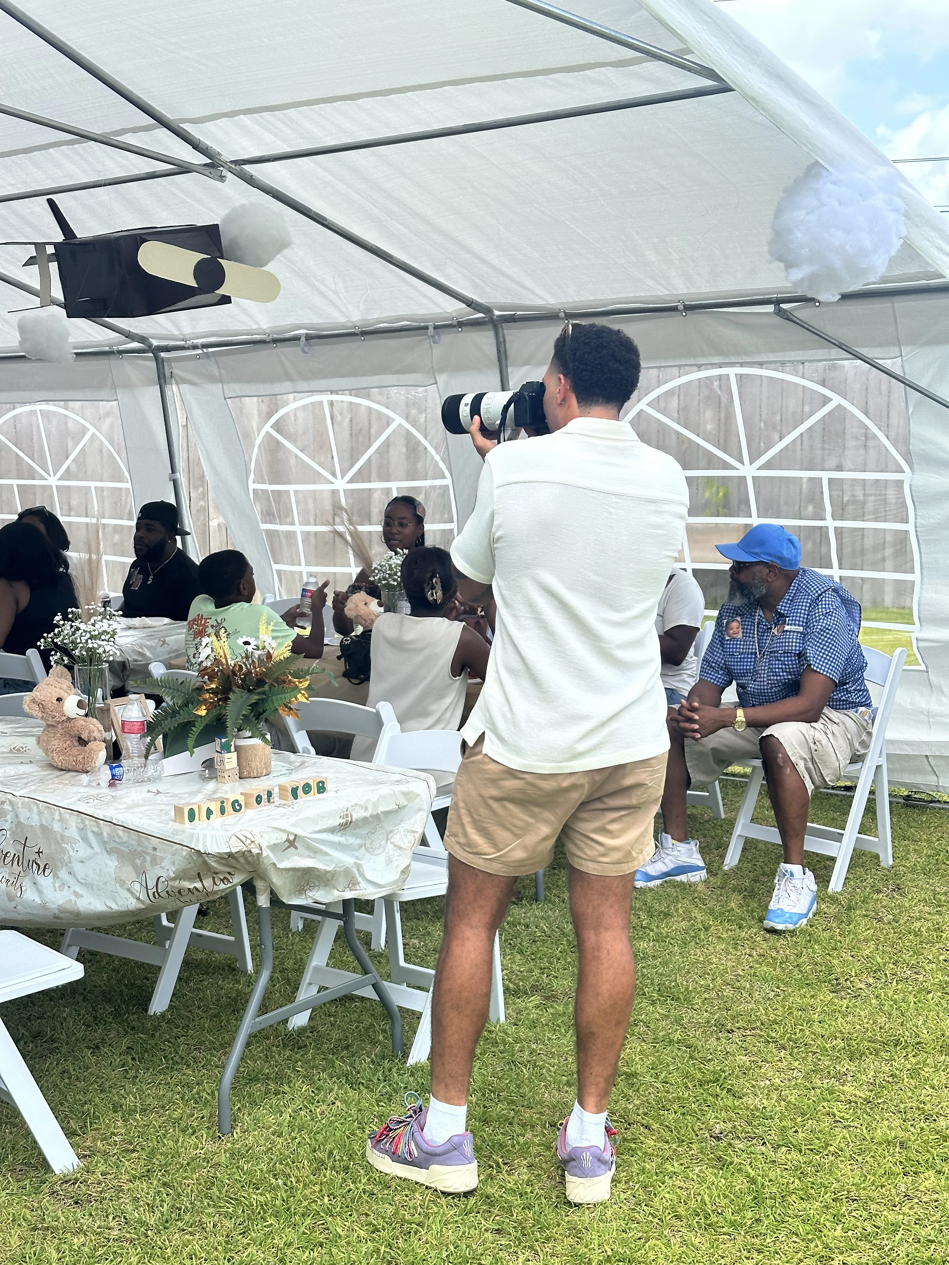 Ja'Von Williams photographing guests at a Houston baby shower