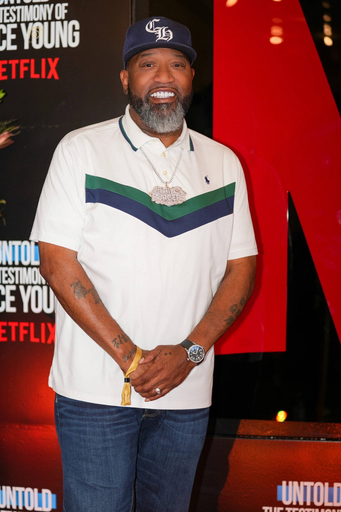 Bun B photographed on the burnt-orange carpet at the Vince Young documentary premiere