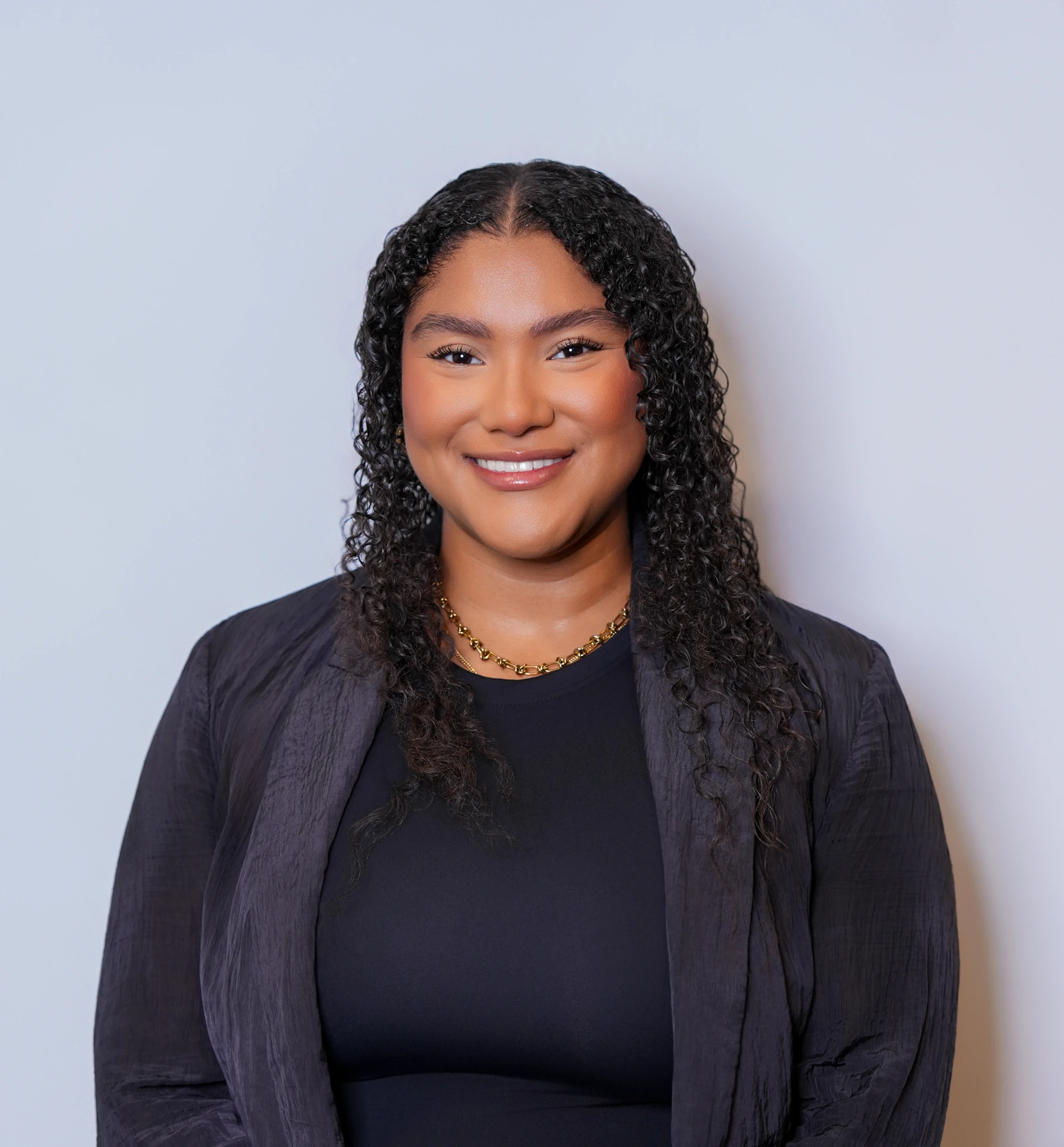 Houston professional wearing a black blazer during a polished headshot session