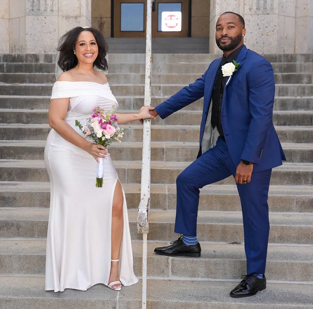 Houston newlyweds posing on stone steps