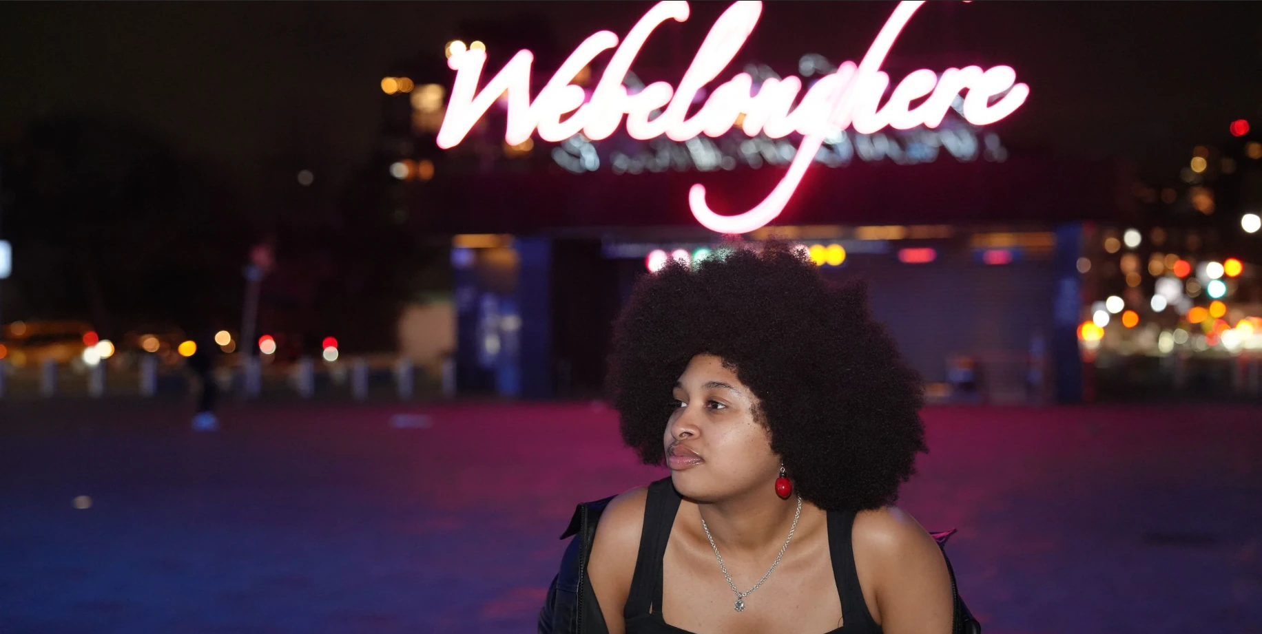 Creative night portrait under Houston neon lights